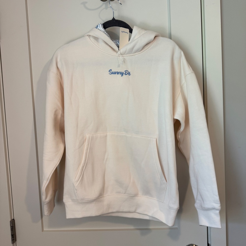 Sunny Di Cream Shell Graphic Hoodie Sweatshirt Womens XS NWT Coastal Blue Logo